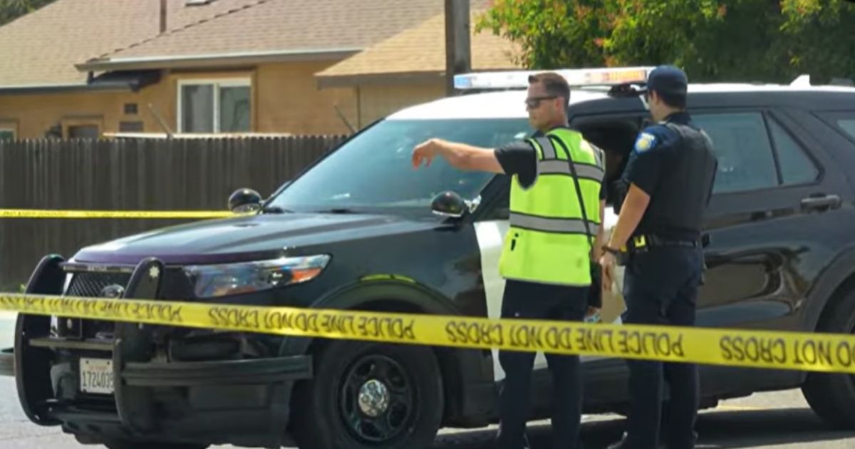 Sacramento Police accident investigator talking to officer at Northgate Boulevard crash scene