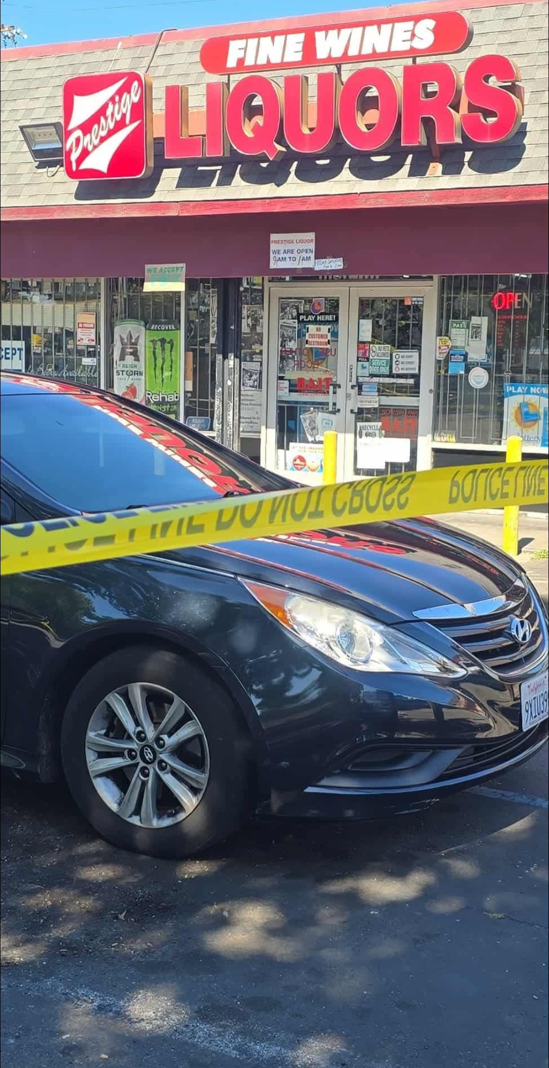 Crime scene tape outside Prestige Wine and Liquor on Howe Avenue Arden Arcade Sacramento